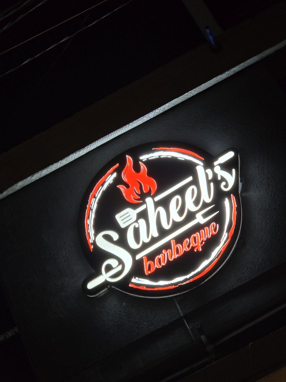 Illuminated barbecue restaurant sign fabricated by HuRu Studios